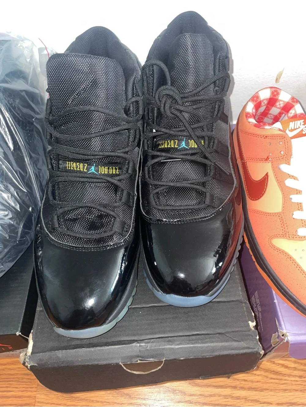 Jordan Air Jordan 11 Retro Black Patent Leather with Icy Blue Sole